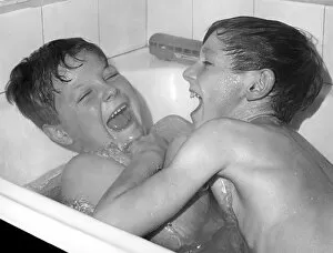 Amusement Collection: Two boys playing in the bath, Horley, Surrey, c1960-1979(?)