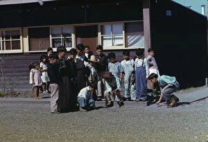 Camp Gallery: Boys playing marbles, FSA... labor camp, Robstown, Texas, 1942. Creator: Arthur Rothstein