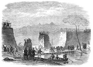 Wheelbarrow Prints: A break in the railway at Pontoise, 1871. Creator: Unknown