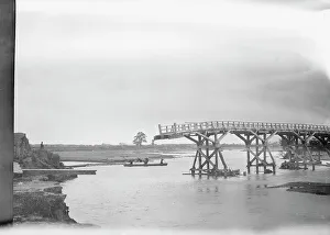 Wooden Bridge Prints: Bridge partially extended over a body of water, Japan, 1908. Creator: Arnold Genthe
