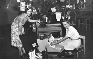 Employee Prints: Brisbane Kindergarten Teachers College students/staff with presents and the Christmas tree