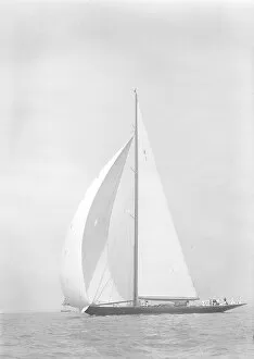 Britannia Collection: Britannia sails downwind under spinnaker, 1935. Creator: Kirk & Sons of Cowes