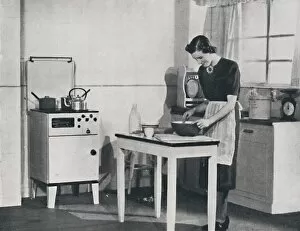 A British kitchen equipped with a cabinet gas cooker, 1942