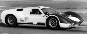 Racing Car Prints: British racing driver and engineer Ken Miles driving a 1966 Ford GT40 J racing car