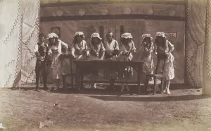 British servicemen in drag acting out a cooking class, 1918. Creator: Unknown