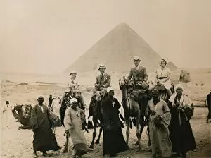 British tourists seated on camels in front of The Great Pyramid, Giza, Egypt, 1936