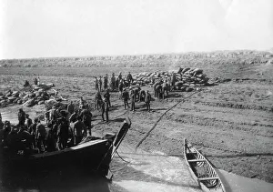 Dates Prints: British troops unloading dates on the shore of the Tigris river, 1918