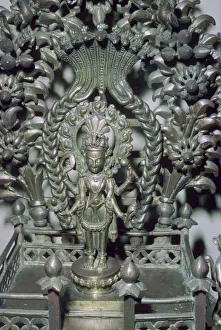 Bronze figure of Vishnu, protected by a many-headed serpent