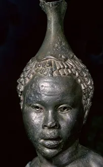Bronze vessel in the form of the head of a young African woman Bronze vessel in the form of the head of a young African woman