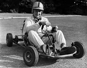 Mclaren Prints: Bruce McLaren on his Em-Bee Wasp kart. Creator: Unknown