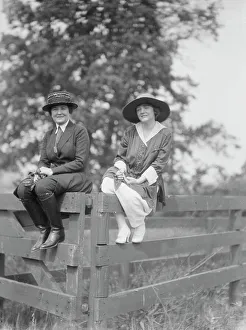 Group Portraits Prints: Bruce, Mrs. and Miss Hedman, seated outdoors on a fence