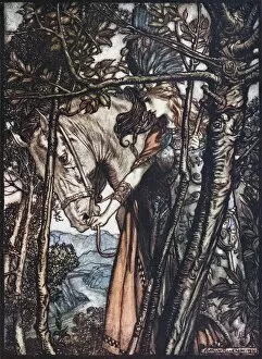 Brunnhilde leads her horse by the bridle. Illustration for The Rhinegold and The Valkyrie by Richa Artist: Rackham