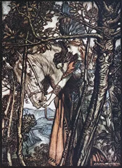 Brunnhilde leads her horse by the bridle. Illustration for The Rhinegold and The Valkyrie by Richa Artist: Rackham, Arthur (1867-1939)