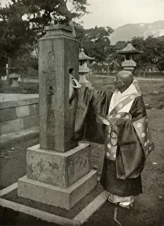 A Buddhist Priest and Praying-Wheel, 1910. Creator: Herbert Ponting