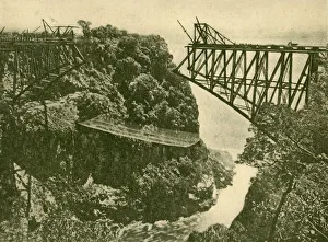 Golding Prints: Building the Zambesi Railway Bridge, c1930. Creator: ENA
