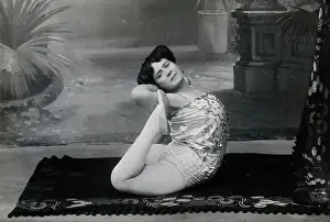 Bending Prints: A Bulgarian female acrobat performing contortions in a photographic studio