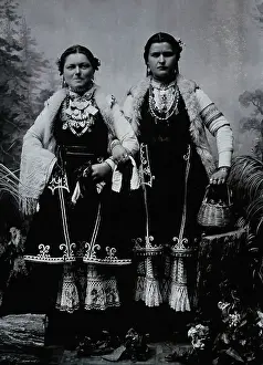 Balkan Prints: Two Bulgarian women arm-in-arm wearing national dress, c1900. Creator: Unknown