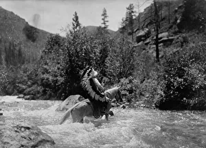 War Bonnet Prints: Bullchief at the ford, c1905. Creator: Edward Sheriff Curtis