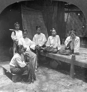 Burma Prints: Burmese women smoking outside their home, Mandalay, Burma, 1908. Artist: Stereo Travel Co