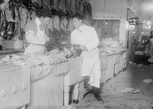 Workwear Prints: Butchers idle at meat counter during meat boycott, 1910. Creator: Bain News Service