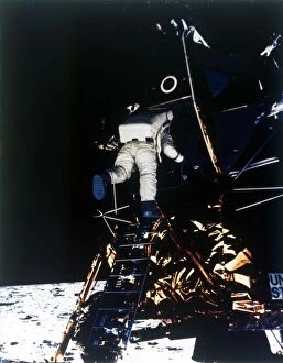 Buzz Aldrin Gallery: Buzz Aldrin descends from the Lunar Module, Apollo II mission, July 1969. Creator: Neil Armstrong