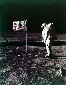 Symbol Gallery: Buzz Aldrin stands next to the American flag on the surface of the Moon, July 1969