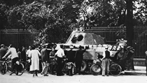 Bystanders examining an abandoned tank on the Rue de Medicis, liberation of Paris, August 1944