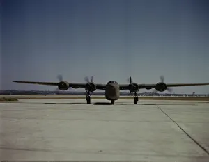 Hollem Howard Prints: A C-87 transport plane, just off the assembly