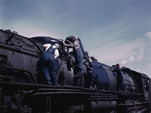 Chicago And North Western Railway Company Gallery: C. & N.W. R.R. women wipers employed at the roundhouse cleaning one of the... Clinton, Iowa, 1943