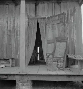 Rocking Chair Prints: Cabin on sugar plantation, Bayou La Fourche, Louisiana, 1937. Creator: Dorothea Lange