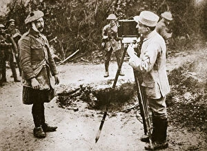 Casualty Collection: Cameraman filming a wounded soldier, Somme campaign, France, World War I, 1916. Artist