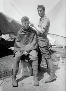 Haircut Prints: Camp Barber, between c1915 and c1920. Creator: Bain News Service