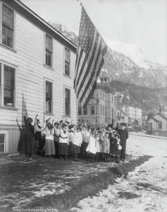 Alaska Prints: Camp-Fire Girls saluting the flag, 1915. Creator: Unknown