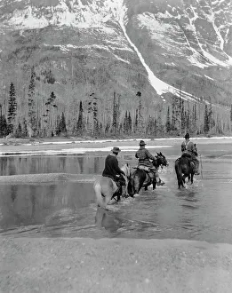 Cowboy Prints: Three campers on horseback cross the Columbia River in Washington