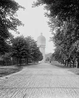 Tyre Track Prints: Campus road leading to stone tower