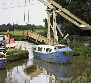 A canal boat passing under a lift bridge on the Llangollen Canal, 1970 A canal boat passing under a lift bridge on the Llangollen Canal, 1970