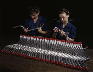 Employee Gallery: Capping and inspecting tubing: two women are shown...at Vultees Nashville division, Tennessee