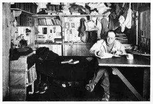 Ponting Prints: Captain Scott Writing Up His Journal, c1911, (1928). Creator: Herbert Ponting