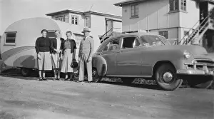 Anticipation Prints: Car with caravan, Mooloolaba, Queensland, 1952. Creator: Jack Bain