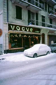 Slippery Prints: Car covered in snow in French street