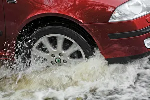 Wheels Prints: Car driving through flood