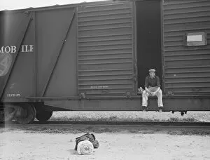 Travelling Gallery: Car on siding across tracks from pea packing plant, Calipatria, Imperial Valley, 1939