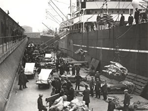 Lowering Gallery: Cargo being loaded or unloaded from a ship, Royal Victoria Dock, Canning Town, London, c1930
