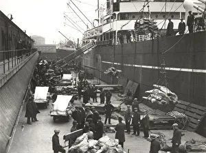 Newham Gallery: Cargo being loaded or unloaded from a ship, Royal Victoria Dock, Canning Town, London, c1930