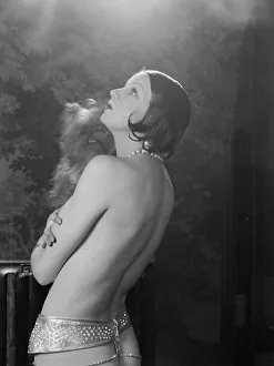 Burlesque Prints: Carise, Erna, Mme. with dog, portrait photograph, 1928 Creator: Arnold Genthe