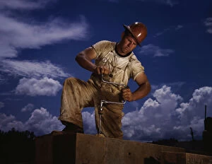 A carpenter at the TVA's new Douglas dam on the French Broad River, Tenn. 1942. Creator: Alfred T Palmer