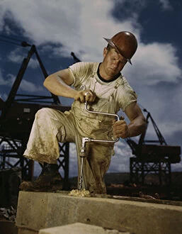 Crane Gallery: Carpenter at work on Douglas Dam, Tennessee (TVA), 1942. Creator: Alfred T Palmer