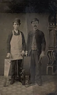 Two Carpenters with a Handsaw, Wood Plane, Hammer, Compass, and Square, 1880s