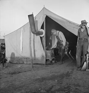 Refugee Camp Gallery: In a carrot pullers camp near Holtville, California, 1939. Creator: Dorothea Lange