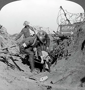 Carrying a wounded soldier to a first aid post, Passchendaele, Belgium, World War I, 1914-1918. Artist: Realistic Travels Publishers